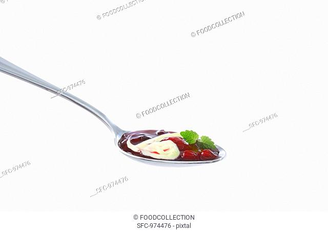 A spoonful of red fruit compote