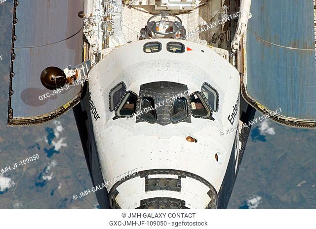 An overhead view of the exterior of Space Shuttle Endeavour's crew cabin, part of its payload bay doors and docking system was provided by Expedition 16...