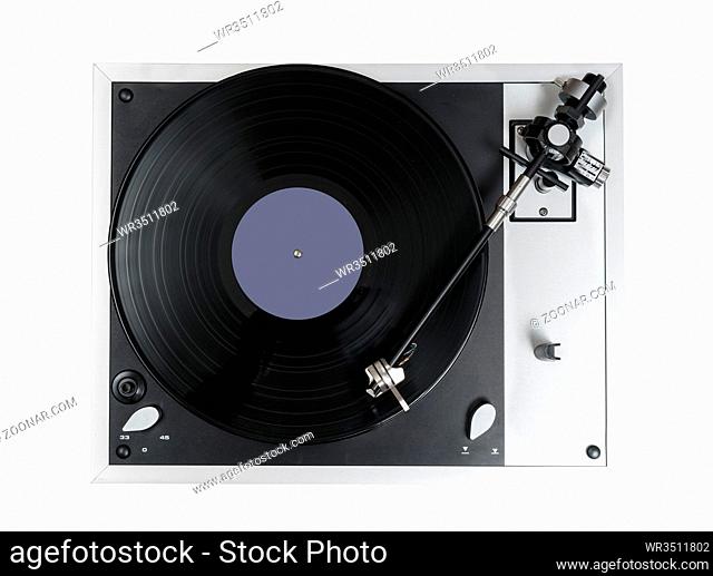 Aerial view top down onto a playing vinyl record on vintage hi-fi stereo turntable isolated against white background