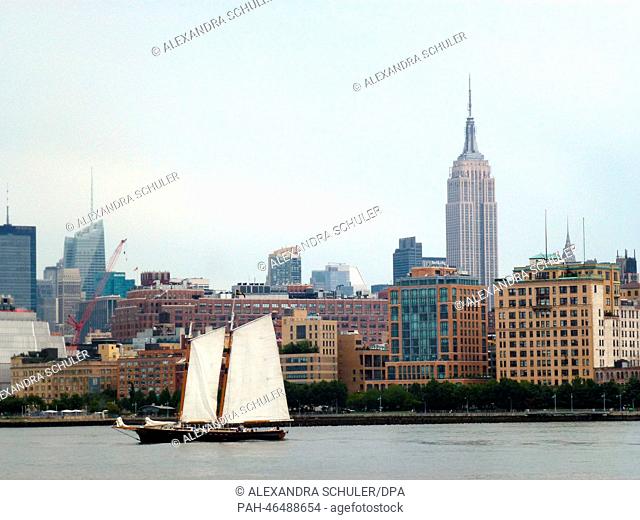 A ship sails down the East River in front of Midtown Manhattan, New York City,  USA, 22 August 2014. The NYSE is the world's largest stock exchange