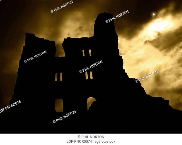 England, North Yorkshire, Whitby Abbey, Looking up to the silhouetted ruins of the Benedictine abbey at Whitby