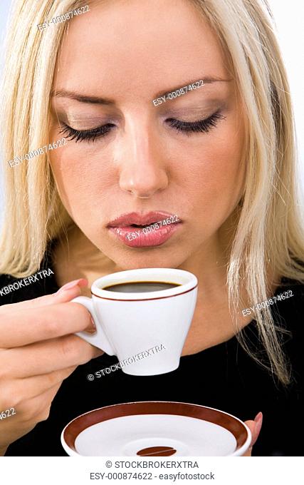 Portrait of pretty woman drinking coffee