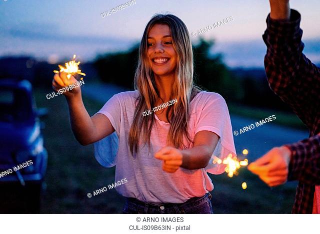 Friends playing with sparklers