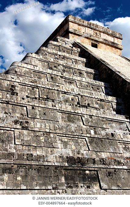 Angled view up El Castillo, the Mayan Pyramid to the god Kukulkan, the feathered serpent, at Chichen Itza, Yucatan, Mexico, on March 20, 2012