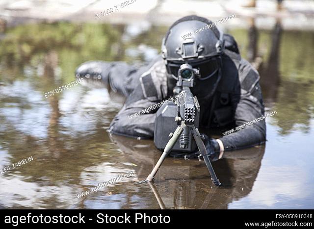 Spec ops police officer SWAT in action in the water