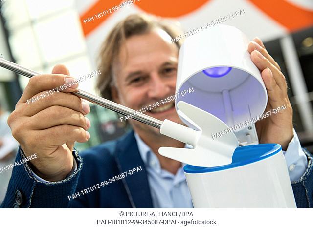 12 October 2018, Bavaria, Nuremberg: Jochen Schmiddem, product designer, presenting a silicone toilet brush during the innovation show at the International...