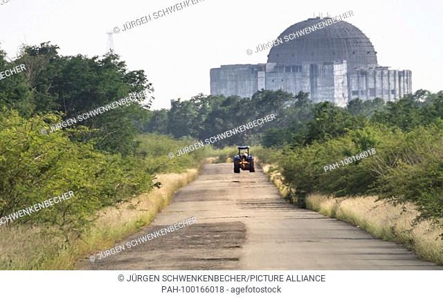 A tractor drives on a lonely country road to the ruins of the Nuclear Power Plant (NPP) in Juragua near Cienfuegos. The NPP, which was started in 1982