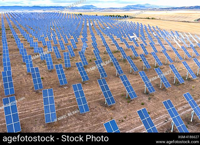 Aerial view of a solar power station and solar energy panels in a rural field. Navarre, Spain. Europe. Environment concept