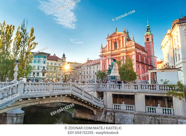 Romantic Ljubljana's city center: river Ljubljanica, Triple Bridge, Tromostovje, Preseren square and Franciscan Church of the Annunciation