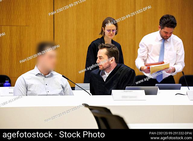 20 January 2023, Bavaria, Munich: ATTENTION, pixelate name tag! One of two men charged with murder (l) sits next to his lawyer Alexander Stevens before the...