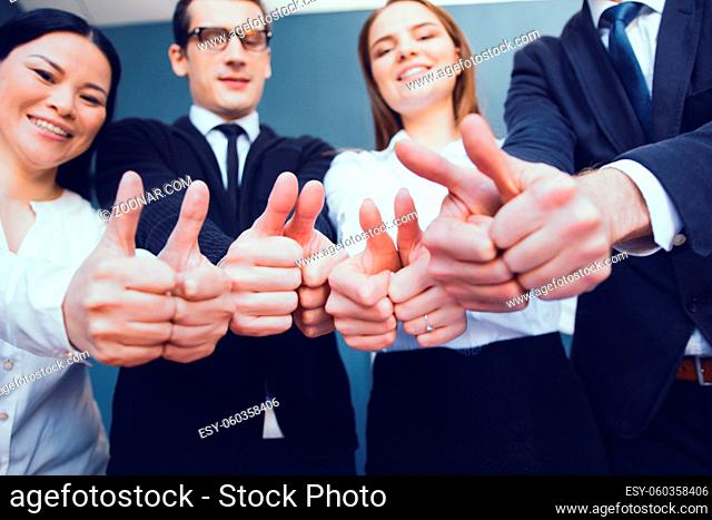 Business Team Showing Thumbs Up After Signing Business Agreement. Business Concept