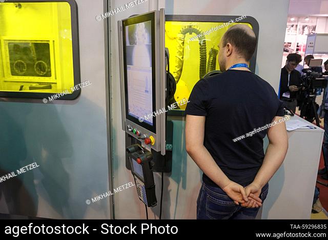 RUSSIA, MOSCOW - MAY 22, 2023: A visitor is seen during a presentation of Russia's largest 3D printer Ilist-2XL using the direct metal laser sintering (DMLS)...