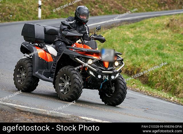 27 March 2021, Rhineland-Palatinate, Nievern: A quad rider is driving on a country road. According to accident expert Brockmann