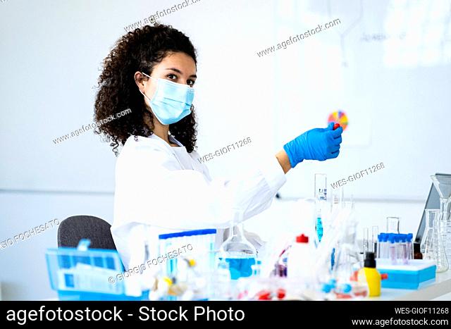 Female scientist experimenting in chemistry lab