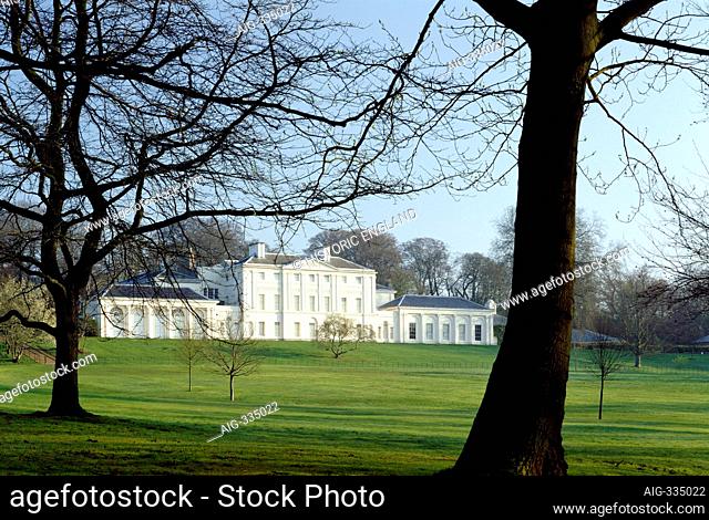 KENWOOD HOUSE, Hampstead, London. Exterior view. The south front viewed through trees, early spring