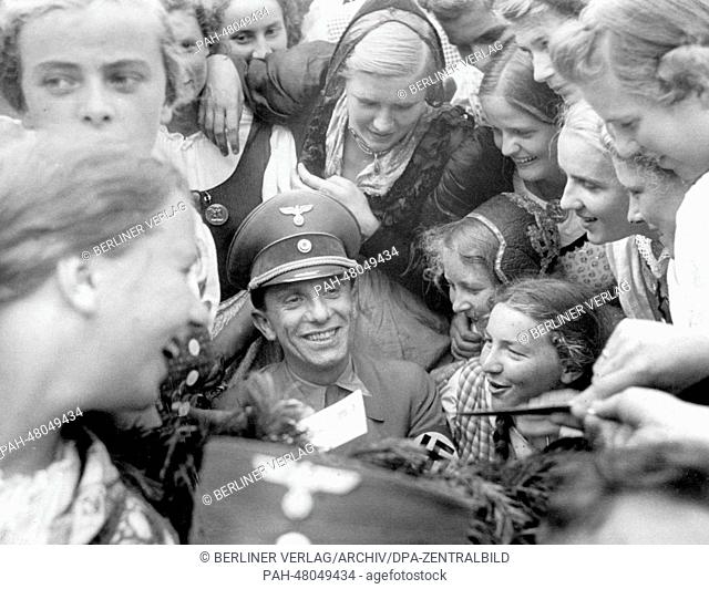 Nuremberg Rally 1938 in Nuremberg, Germany - Reich Minister of Propaganda Joseph Goebbels is surrounded by girls from the Ostmark