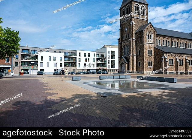 Sambreville, Wallon Region, Belgium, 07 30 2022 - Local church and fountain at the village square