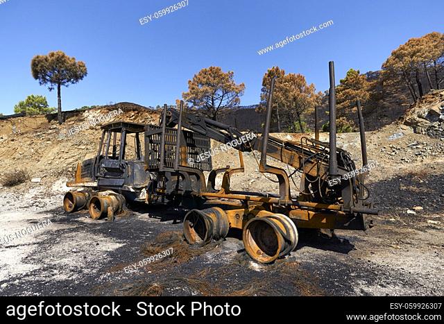Heavy machinery burned by fire in the Jubrique fire next to Sierra Bermaja in the Genal Valley, Malaga. Andalusia, Spain. September 2021