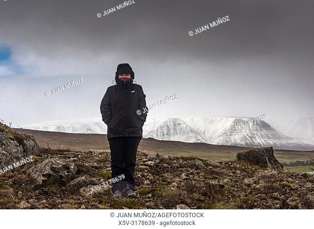 Woman with cold on the outskirts of Akureyri. North Region. Iceland