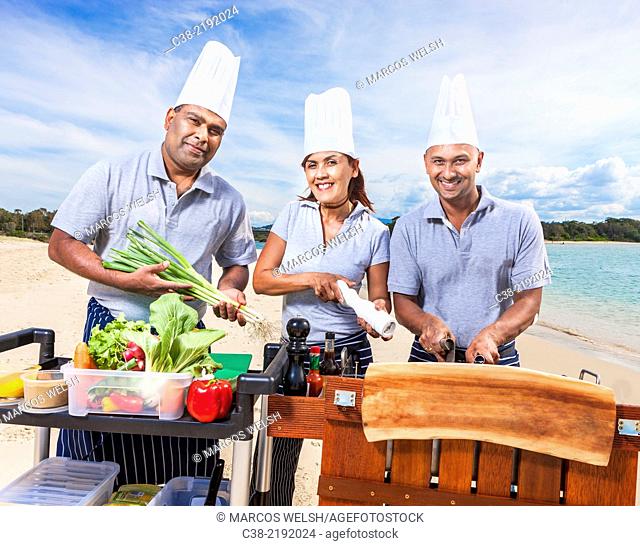 Asian catering chefs at the beach cooking with a Koththu station. Gold Coast, Queensland, Australia