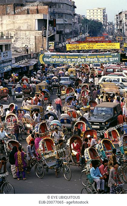 Street crowded with brightly painted and decorated rickshaws