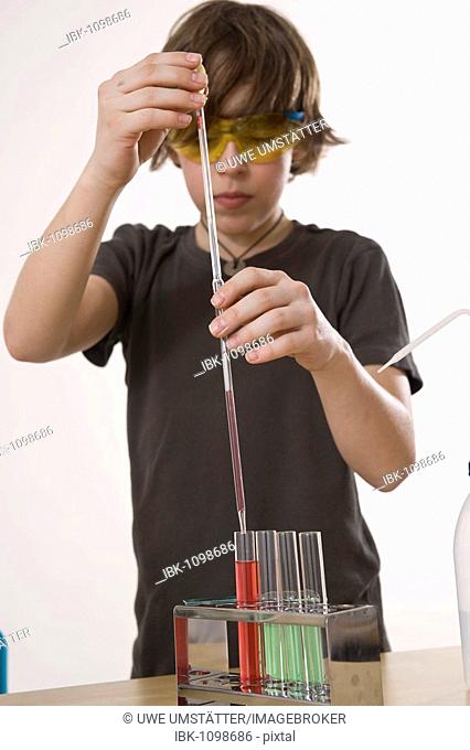 Boy working on an experiment in a laboratory