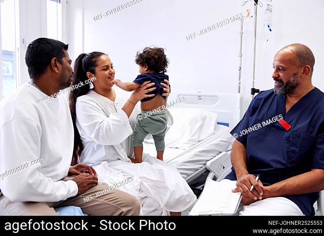 Parents with children in hospital room