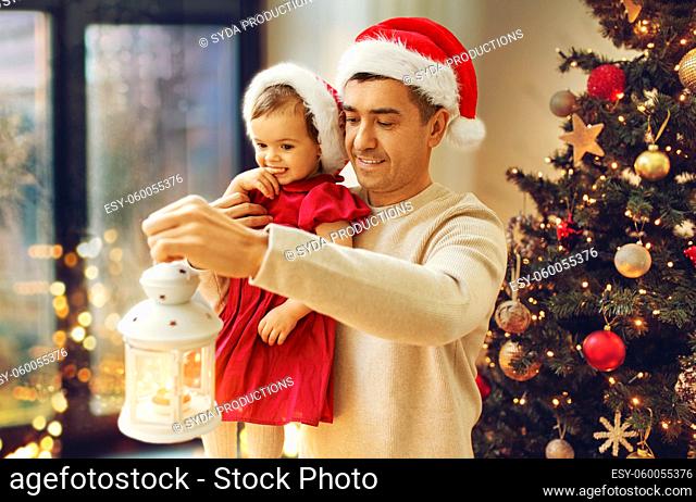 father and baby daughter on christmas at home