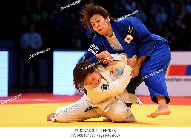 Megumi Tsugane (white, Japan) and Nami Nabekura (blue, Japan) in action during the women's up to 63 kg body weight competition at the Judo Grand Prix in the...