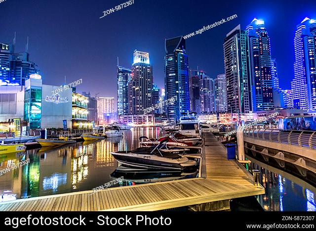 DUBAI, UAE - NOVEMBER 13: Dubai downtown night scene with city lights, luxury new high tech town in middle East, United Arab Emirates architecture