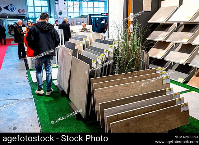 Illustration picture shows people looking at flooring material during the opening day of the 2023 edition of Batibouw, the annual building