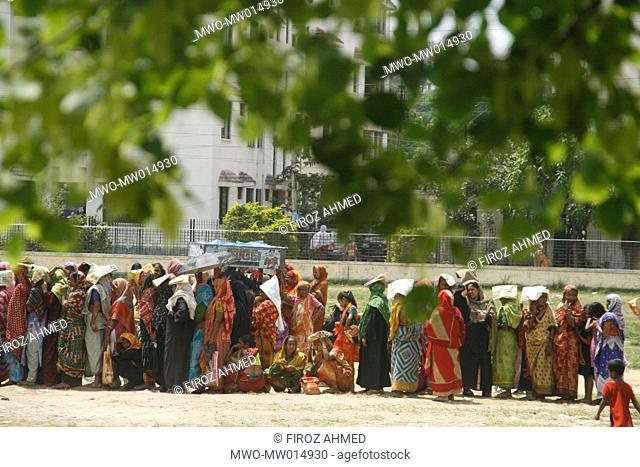 A queue of people with low income, at a fair price shop, run by Bangladesh Rifles, BDR, in Ajimpur, Dhaka Bangladesh April 04, 2008