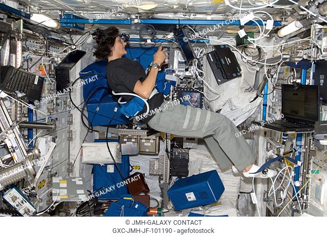 NASA astronaut Sunita Williams, Expedition 32 flight engineer, works on the Reversible Figures (RFx) experiment in the Columbus laboratory of the International...