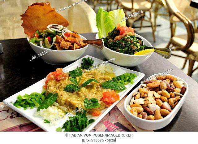 Baba Ganoush, eggplant or aubergine cream, Fattush, bread salad and tabouleh, parsley salad, Arabic mezze, appetizers in a Beirut restaurant, Beirut, Lebanon