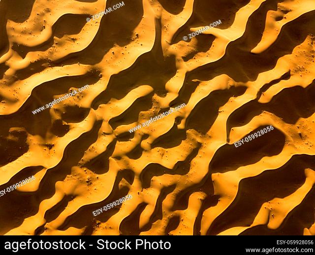 Aerial top view on sand dunes in Sahara desert, Africa