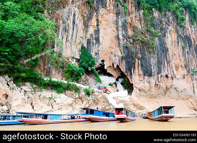 The Pak Ou Caves, known as the Cave of a Thousand Buddhas, are located on a cliff along the Mekong river, some 20 km north of Luang Prabang