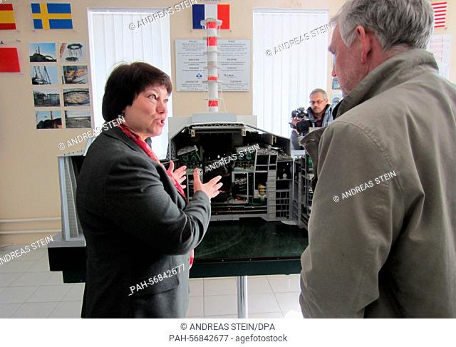 Jochen Flasbarth, permanent secretary at the German Federal Environment Ministry speaks to an employee in Chernobyl, Ukraine, 19 March 2015