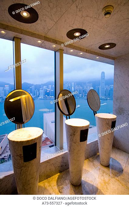 View of Hong Kong Bay from Felix Restaurant (Women's bathroom) designed by Philippe Starck at Peninsula Hotel. Hong Kong. China
