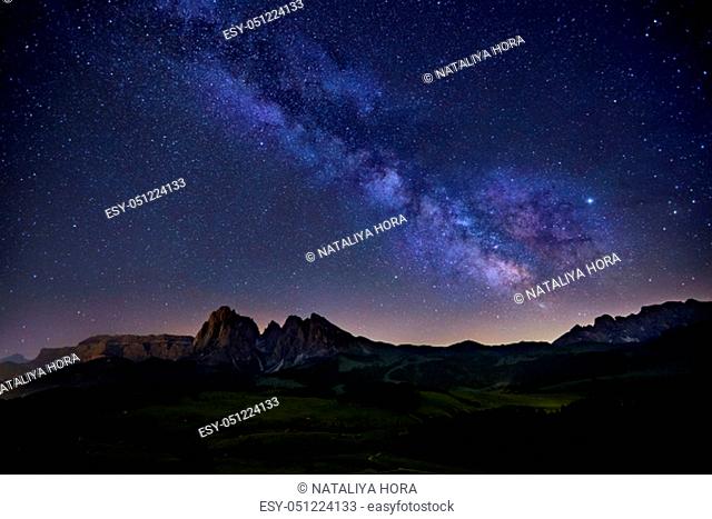 Milky Way over Alpe di Siusi (also known as Seiser Alm) in Dolomites mountain, Sudtirol, Italy