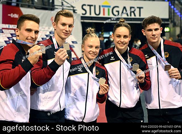 20 March 2022, Baden-Wuerttemberg, Stuttgart: Gymnastics, DTB Cup, Mixed. Carlo Hörr (l-r), Glenn Trebing, Lea Quaas, Sarah Voss and Dario Sissakis from Germany...
