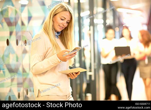 Young businesswoman using smart phone