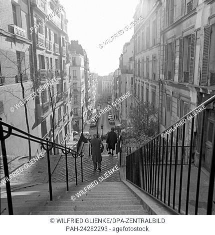 View of the stairs that go down from the basilica Sacre Coeur in the direction of the quarter Montmartre in Paris, France, in November 1970
