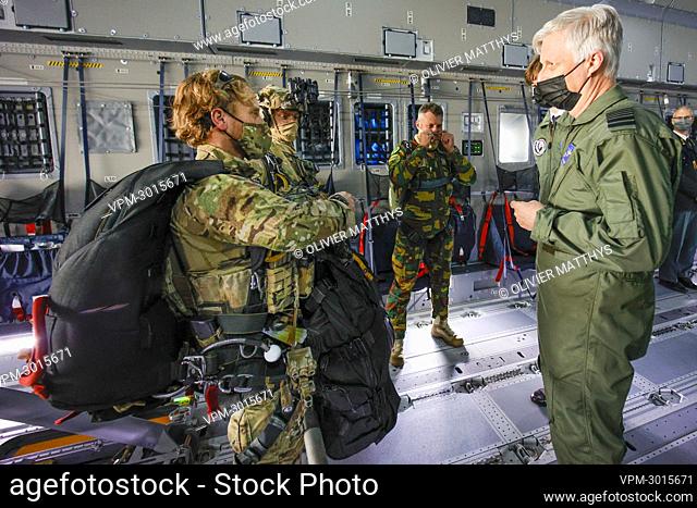 King Philippe - Filip of Belgium talks with soldier ahead of a parachute jump, inside the Airbus A400M aircraft during a flight