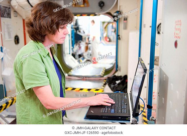 NASA astronaut Catherine Coleman, Expedition 2627 flight engineer, uses a computer during a routine operations training session in an International Space...