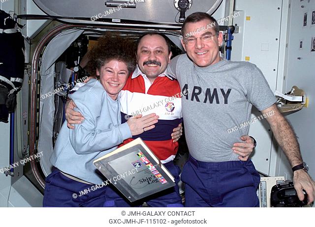 The Expedition Two crewmembers, Susan J. Helms (left), flight engineer, cosmonaut Yury V. Usachev, mission commander, and James S