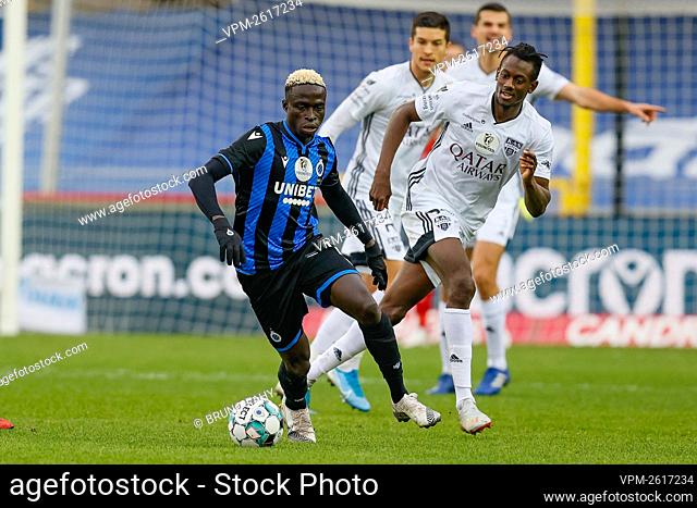 Club's Krepin Diatta and Eupen's Amara Baby fight for the ball during a soccer match between Club Brugge KV and KAS Eupen, Saturday 26 December 2020 in Brugge