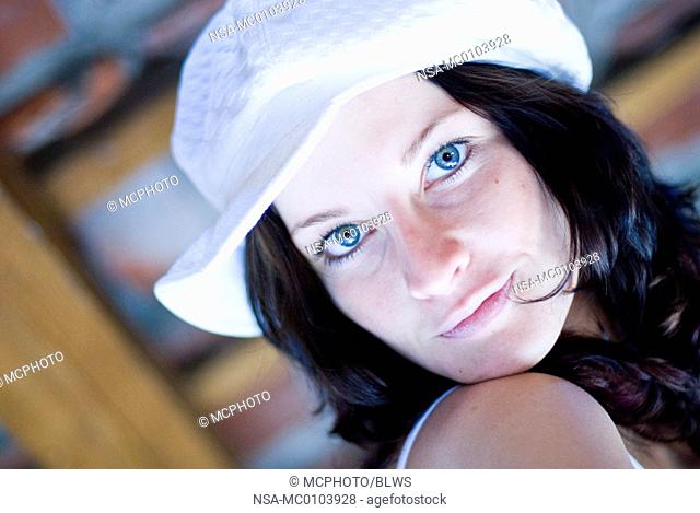 cute dark-haired woman with fashinable cap