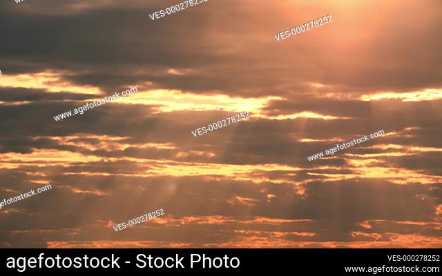 Sunset Cloudy Sky With Fluffy Clouds. Sunset Sky Natural Background. sunrays, sunray, ray, Dramatic Sky