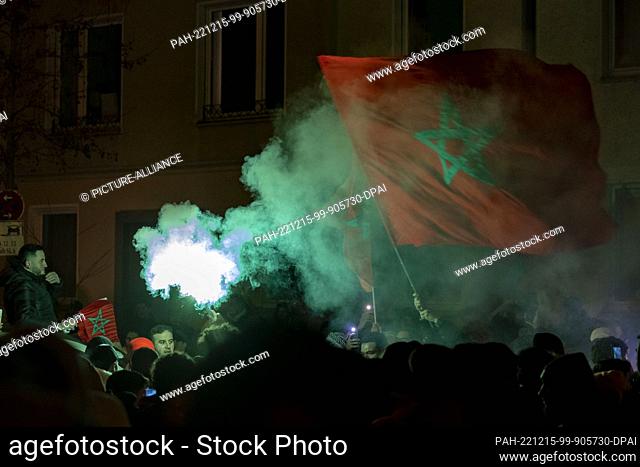 14 December 2022, North Rhine-Westphalia, Duesseldorf: Soccer, World Cup, France - Morocco, final round, semifinal, Moroccan fans celebrate their team's...