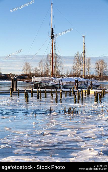 Sailing ketch docked and protected for the winter season in Steveston British Columbia Canada